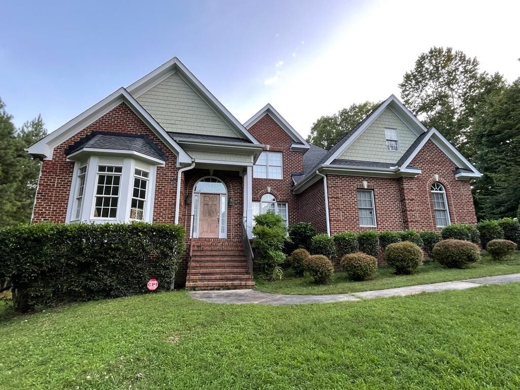 f7b8d905-1bb4-4ba7-ae8d-da3a49e7ce29_item_35860eed-0ce4-4382-b7c3-28ff97cbc142 Two-story home with multiple gables and a new shingle roof in Raleigh, NC