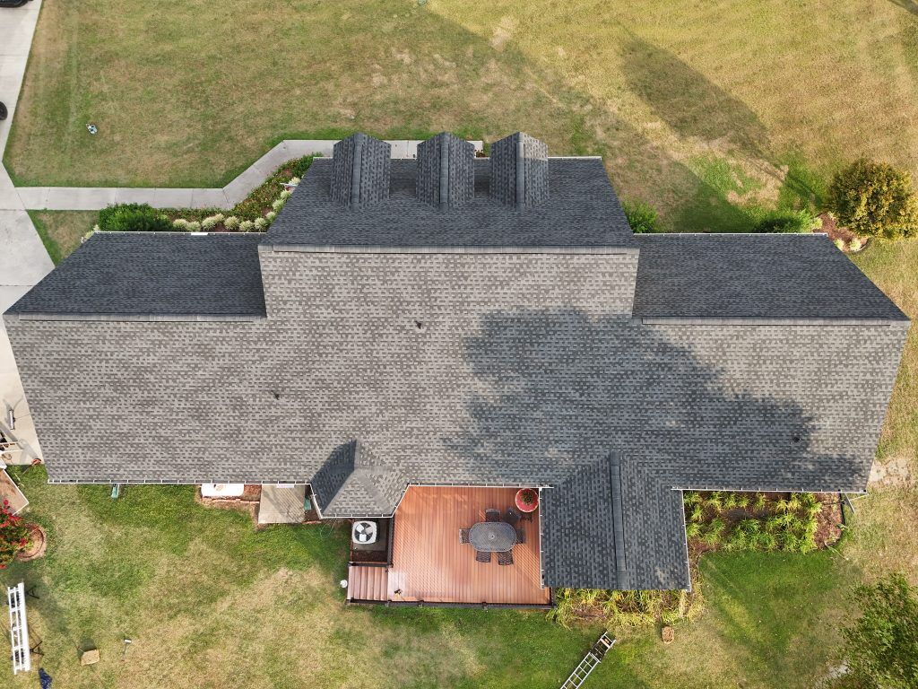 item_226c69b8-743d-448d-8a72-b27abc51075c Brick home with dormer windows and a freshly installed shingle roof in Raleigh, NC