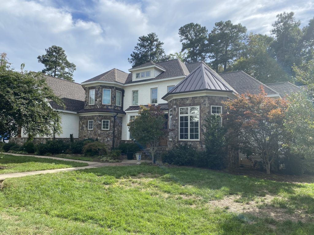 item_6695b0a5-52b0-4892-8aee-e97fd25baca3 Ground-level view of a completed roofing project in Raleigh, NC