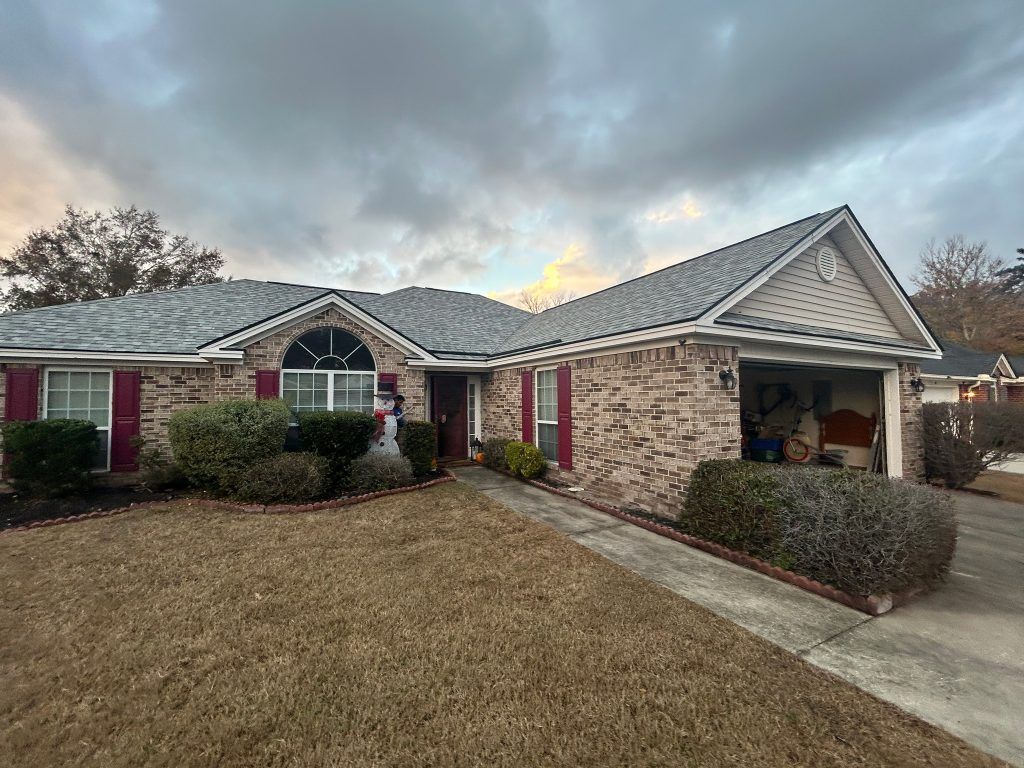 item_71f3a035-7cd0-485f-b62f-3407d3c1bbbb Aerial drone view of a completed shingle roof replacement in Savannah, GA
